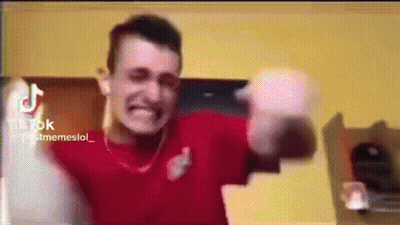 Man In Red Shirt Making Funny Face Holding Bottle GIF
