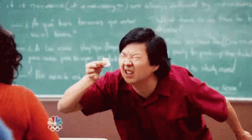 Man In Red Shirt Making Funny Face In Classroom GIF