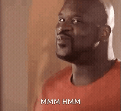 Man In Red Shirt Making Funny Face Saying Hmm Hmm GIF