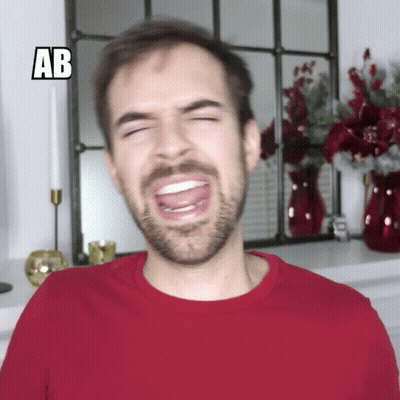 Man In Red Shirt Making Funny Face With AB GIF