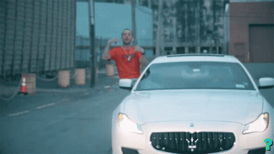 Man In Red Shirt Next To White Maserati GIF