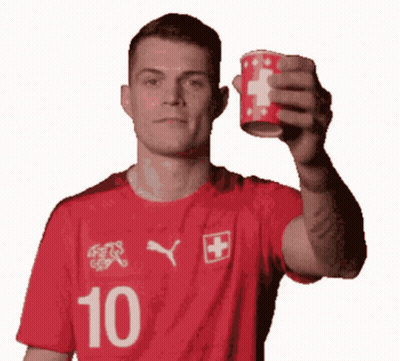 Man In Red Shirt Number 10 Holding Cup GIF