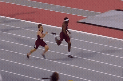 Man In Red Shirt Number 14 Falling On Track GIF