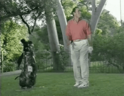 Man In Red Shirt On Golf Course GIF