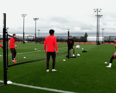Man In Red Shirt On Soccer Field Saying Soccer GIF