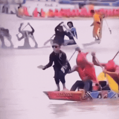 Man In Red Shirt On Triathlon Boat GIF