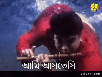 Man In Red Shirt Playing Flute GIF
