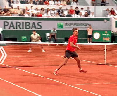 Man In Red Shirt Playing Tennis By BNP Paribas Ad GIF