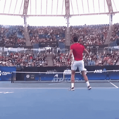 Man In Red Shirt Playing Tennis GIF