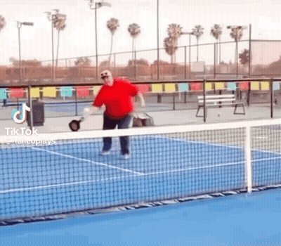 Man In Red Shirt Playing Tennis GIF