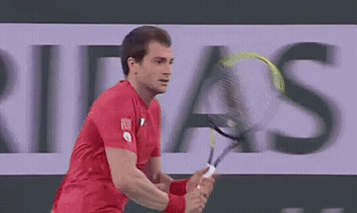 Man In Red Shirt Playing Tennis With Ribas Ad GIF