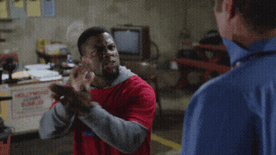 Man In Red Shirt Pointing At Man In Blue Shirt GIF