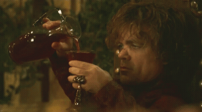 Man In Red Shirt Pouring Drink Into Glass GIF