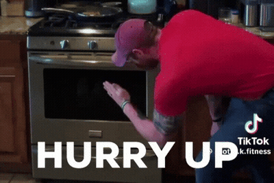 Man In Red Shirt Reaching Into Oven Hurry Up GIF