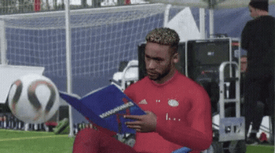 Man In Red Shirt Reading Rossonomics GIF