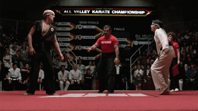 Man In Red Shirt Referee Karate Championship Board GIF