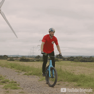 Man In Red Shirt Riding Bike On Dirt Road YouTube Originals GIF