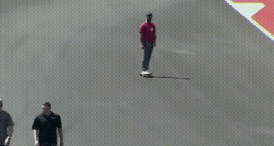 Man In Red Shirt Riding Skateboard GIF