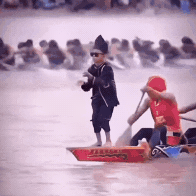 Man In Red Shirt Rowing Boat With Chinese Writing GIF