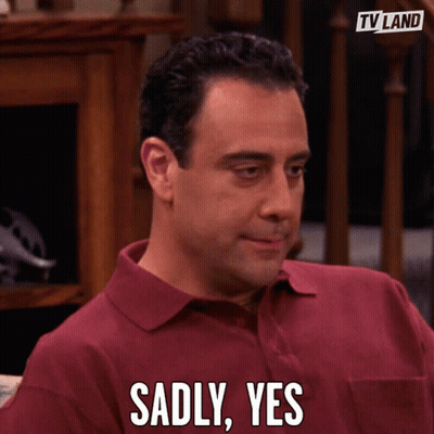 Man In Red Shirt Sadly Says Yes In Front Of TV Land Logo GIF
