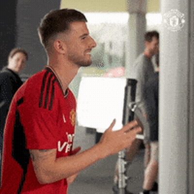 Man In Red Shirt Saying Fly Emirates GIF
