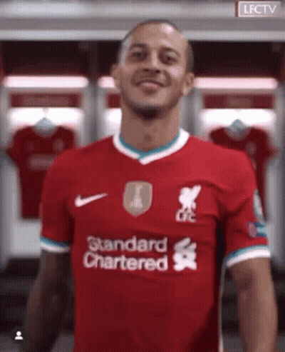 Man In Red Shirt Saying Standard Chartered GIF