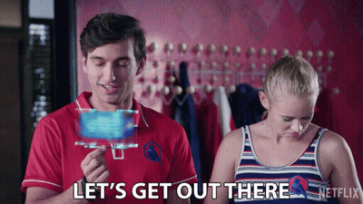 Man In Red Shirt Says Let's Get Out There Next To Woman In Striped Tank Top GIF