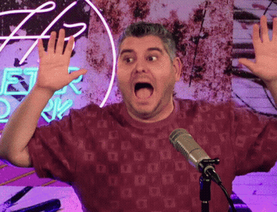 Man In Red Shirt Singing At Microphone GIF