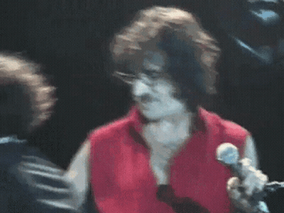 Man In Red Shirt Singing Into Microphone GIF