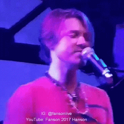 Man In Red Shirt Singing Into Microphone GIF