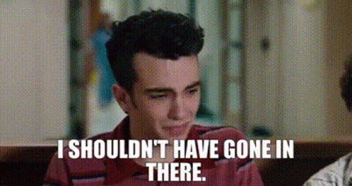 Man In Red Shirt Sitting At Table With Quote GIF
