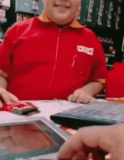 Man In Red Shirt Sitting At Tablet GIF