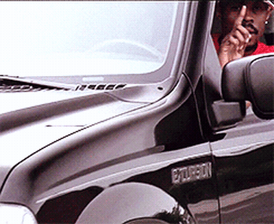 Man In Red Shirt Sitting In Black Ford Explorer GIF