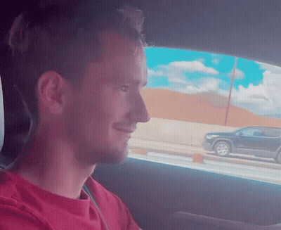 Man In Red Shirt Sitting In Driver Seat GIF