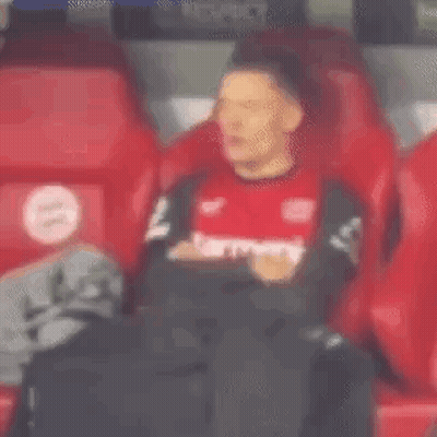 Man In Red Shirt Sitting In Red Seat GIF