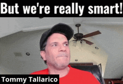 Man In Red Shirt Sitting With Caption But We're Really Smart Tommy Tallarico GIF
