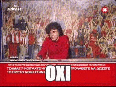 Man In Red Shirt Sitting With Oxi Behind Him GIF