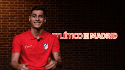 Man In Red Shirt Smiling At Atlético Madrid GIF