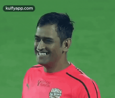 Man In Red Shirt Smiling At Camera GIF