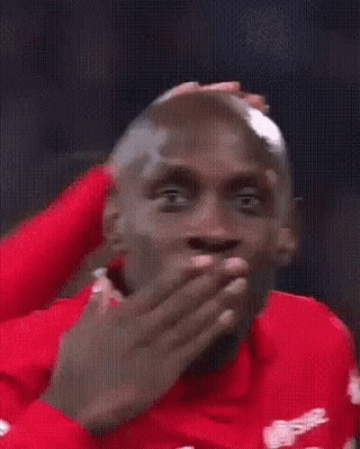 Man In Red Shirt Smiling At Camera GIF