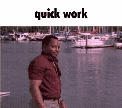 Man In Red Shirt Standing By Water With Boats GIF