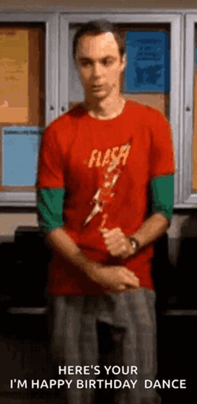 Man In Red Shirt Standing In Front Of Bulletin Board GIF