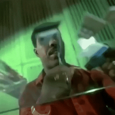 Man In Red Shirt Standing In Front Of Green Background Letter R GIF