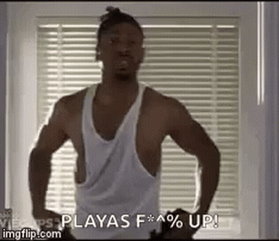 Man In Red Shirt Standing With Hands Up GIF