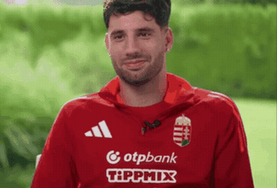 Man In Red Shirt Surrounded By Two Red Hearts With Name Szobo GIF