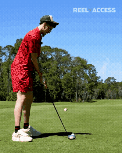 Man In Red Shirt Swinging Golf Club GIF