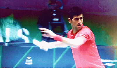 Man In Red Shirt Swinging Tennis Racquet With US Sign GIF
