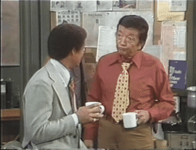 Man In Red Shirt Talking Holding Coffee GIF
