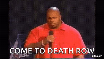 Man In Red Shirt Talking Into Microphone GIF