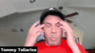 Man In Red Shirt Talking On Phone Tommy Tallarico GIF